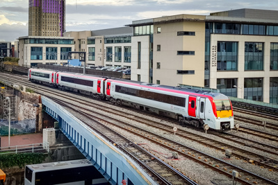 Image of a train in front of a building