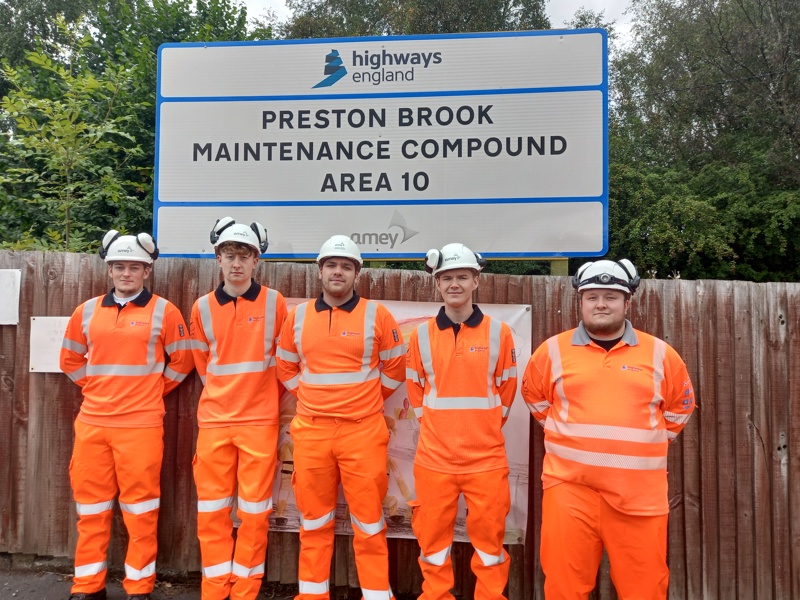 Men in PPE, stood in front of Preston Brook Maintenance Compound Area 10.