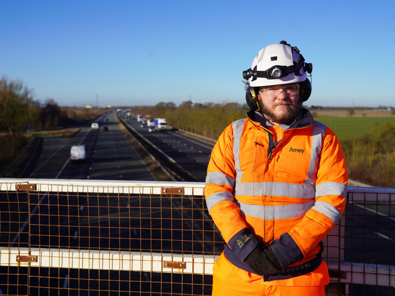Apprentice standing a bridge 
