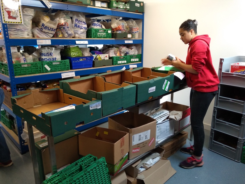 A volunteer helping at a food bank.