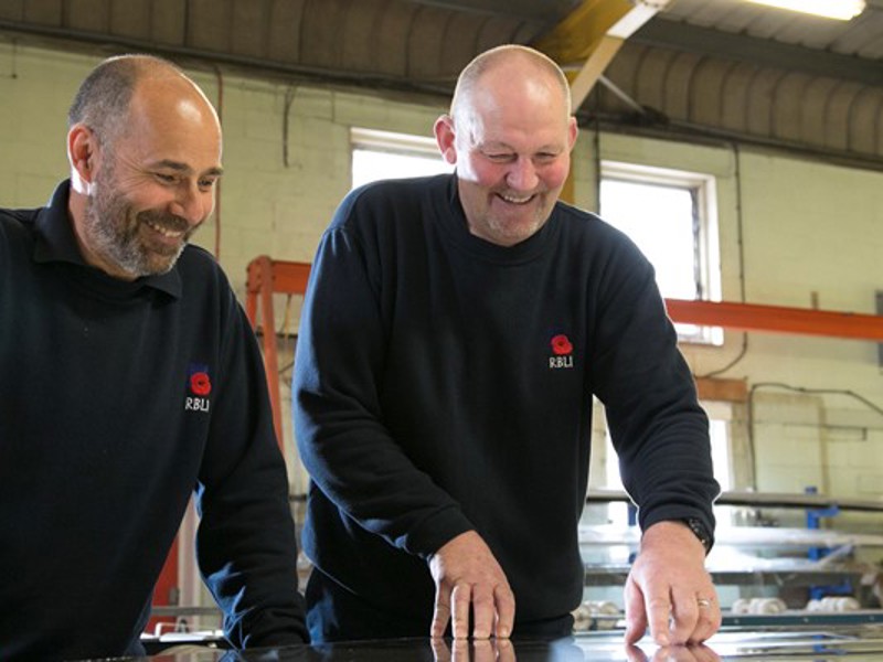 Two men wearing RBLI attire.