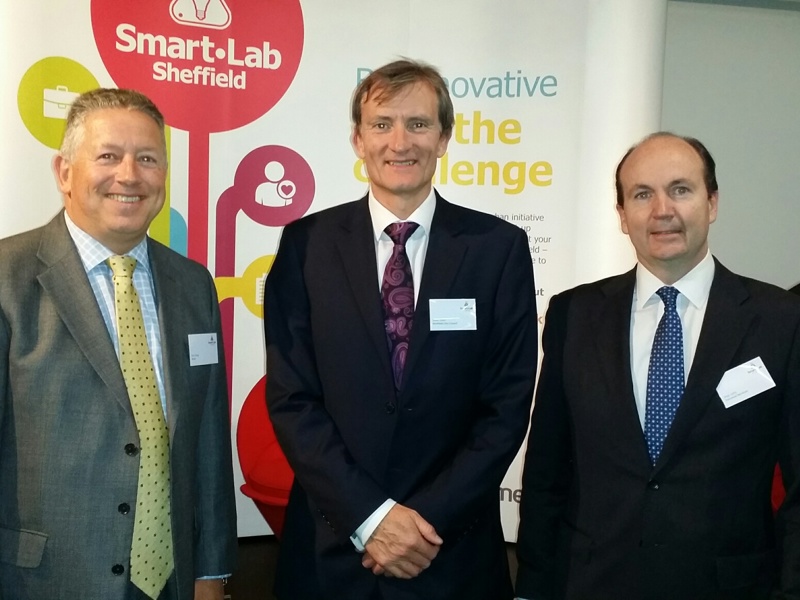 Three men stood in suits.