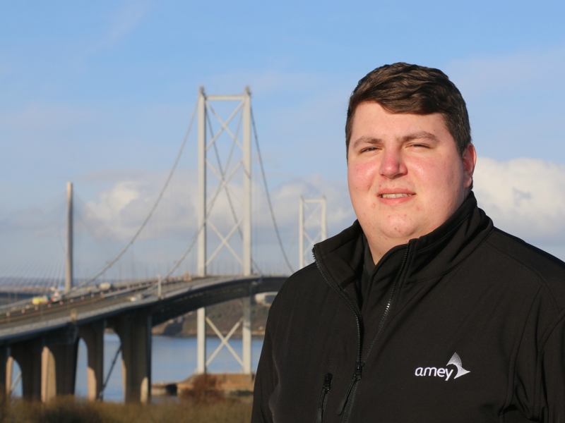 James Kleiman stood in front of a bridge.