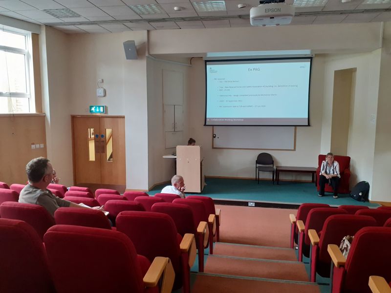Image of people sat in an auditorium. 