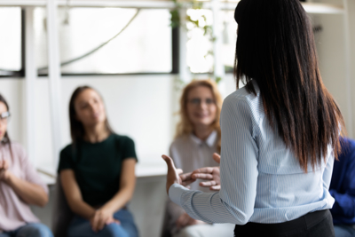 Image of woman presenting to young people
