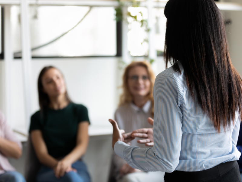 Image of woman presenting to young people