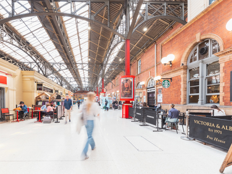 Image of people walking in train station