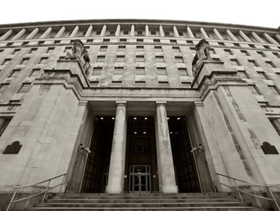 Image of a building with an pillar entrance way.