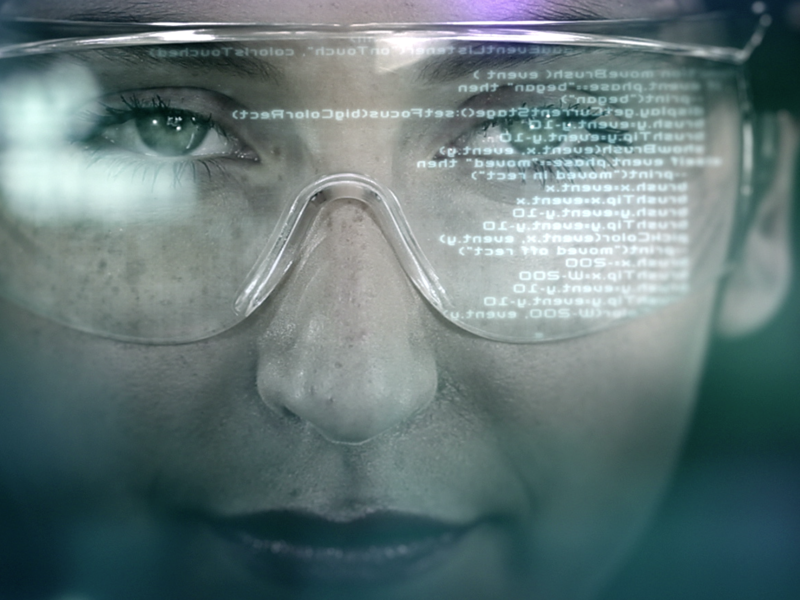 Image of a woman, wearing safety goggles.