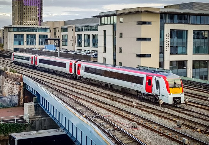 Image of a train in front of a building