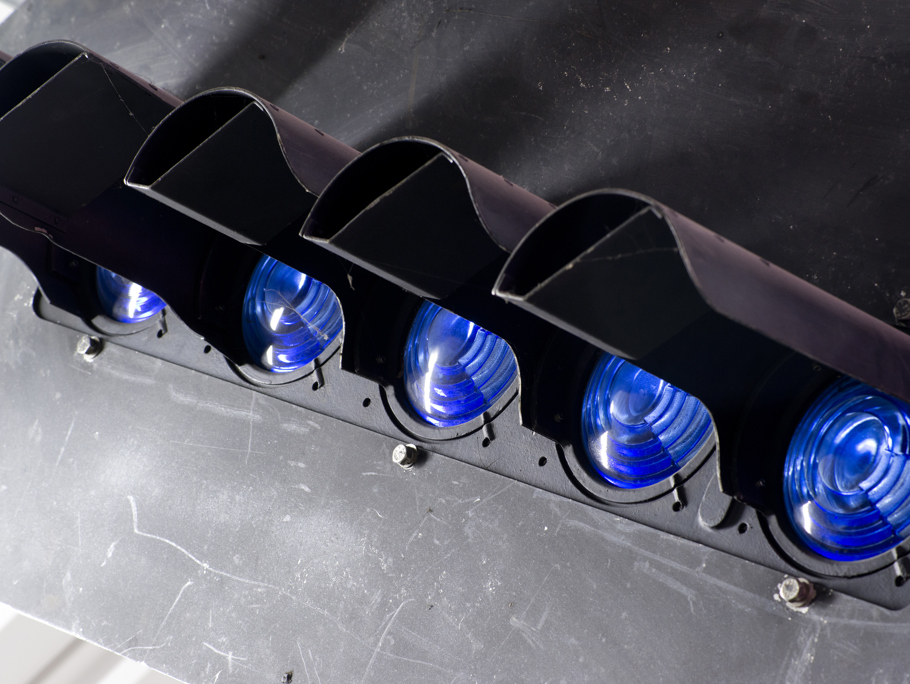 Up close image of blue rail lights