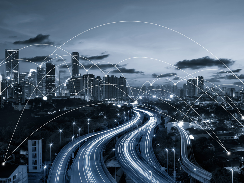 Image of a city, with curved lines pin pointing buildings