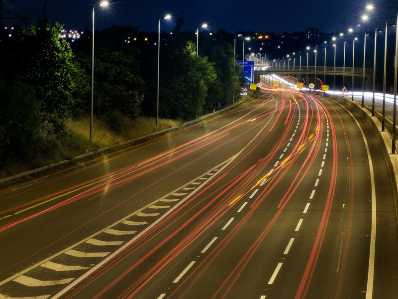 Image of a highway at night.