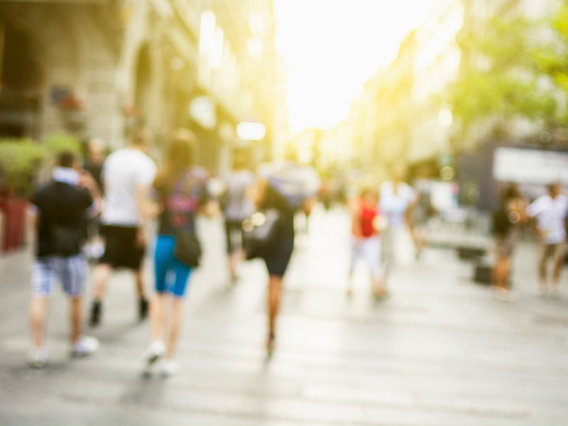 Blurred image of a busy highstreet.
