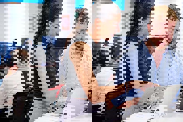 Image of Amey employees working together in an office environment