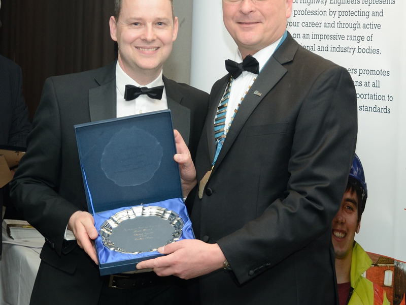 Richard Harris holding an award.
