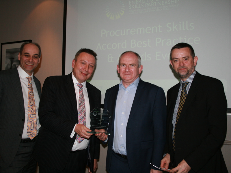 Group image of Amey employees holding an award.