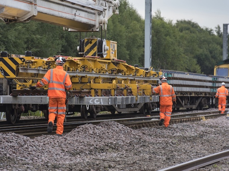 Men in PPE on a rail track