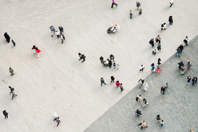 Ariel view of people walking in a paved area.