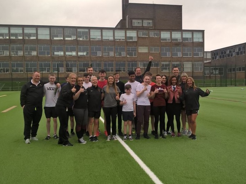 Image of school children on an AstroTurf pitch.