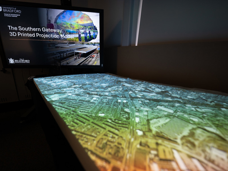Image of a presentation on a projection screen.