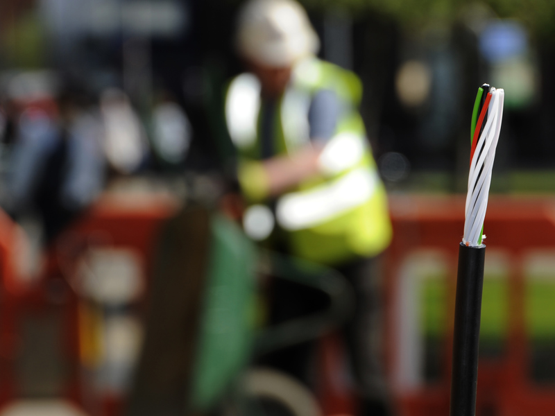 Image of a wire, with a blurred background.