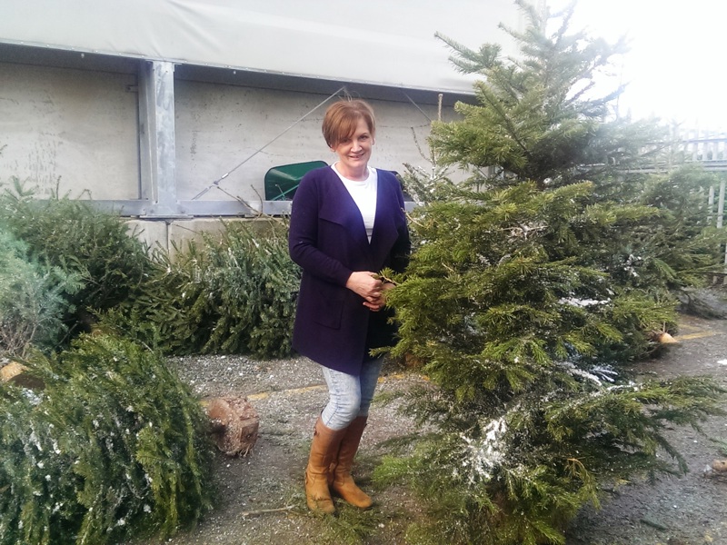 Image of an Amey employee stood in a communal garden.