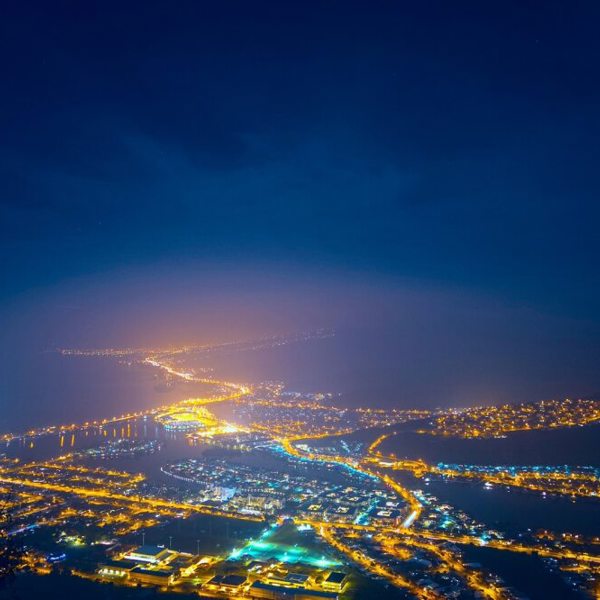 Night time image of a lit up cityscape.
