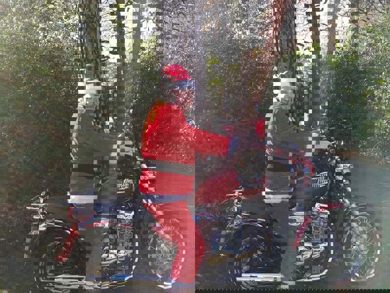 Image of a man dressed as Santa on a motorcycle.