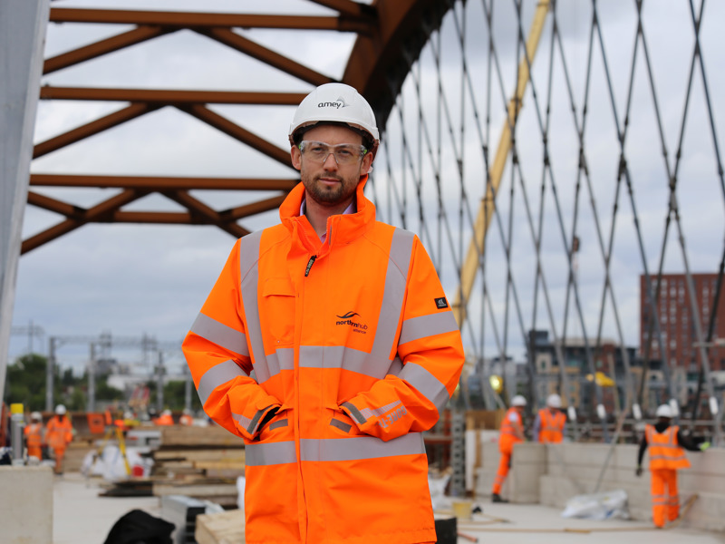 Image of an Amey employee wearing PPE on a construction site.