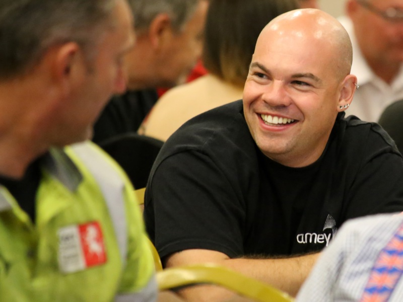 image of two Amey employees sharing a conversation. 