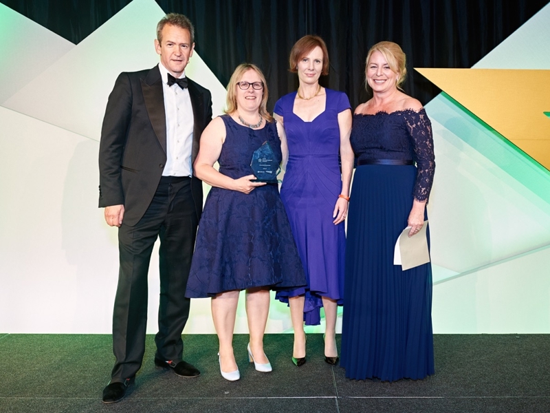Group image of Amey employees holding an award.