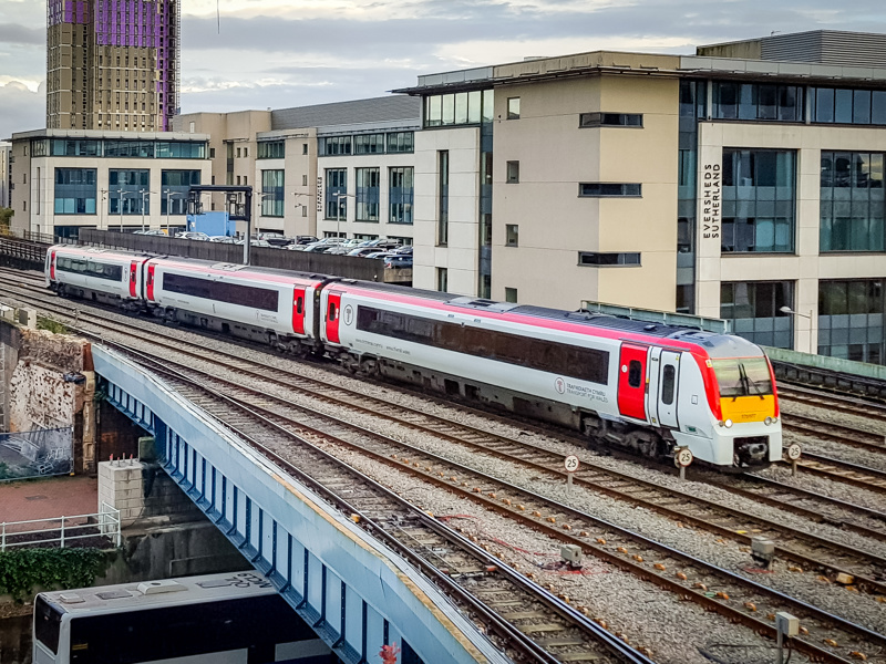 a train in front of a building.