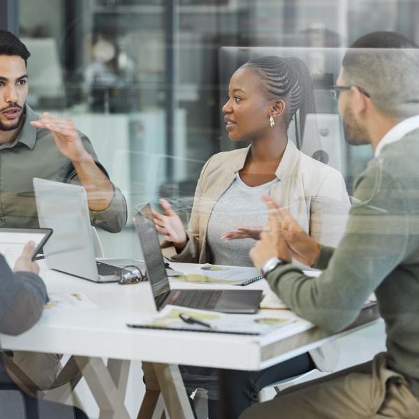 Image of team collaborating at an office desk