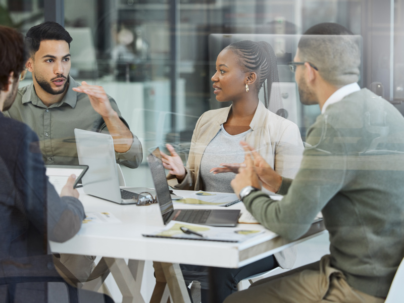 Image of team collaborating at an office desk