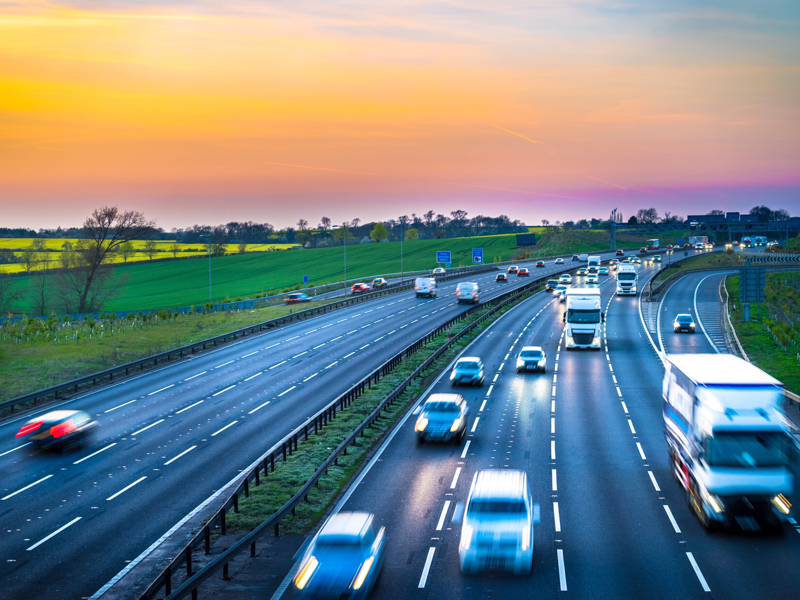 a highway with a red skyline 