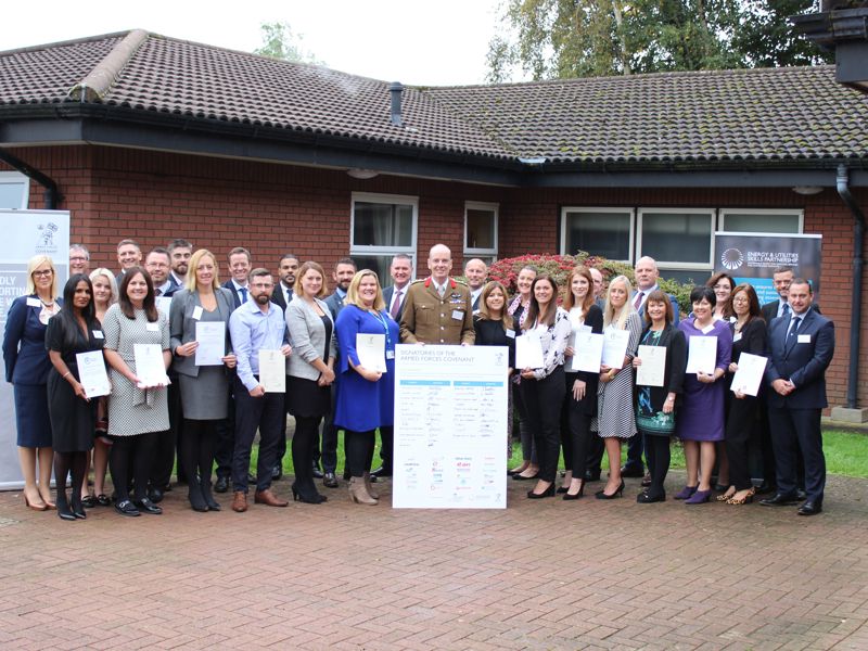 A group of people, holding certificates.