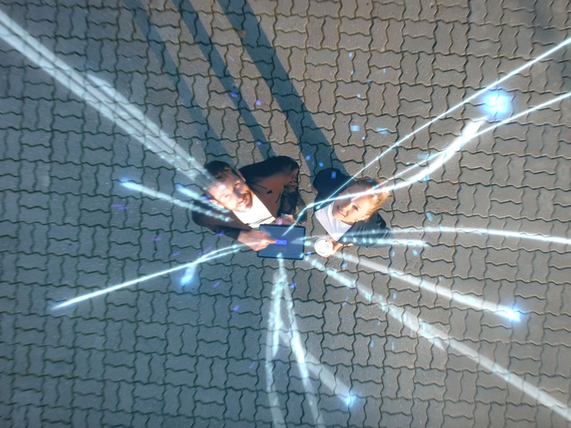 ariel image of a man and woman looking up.