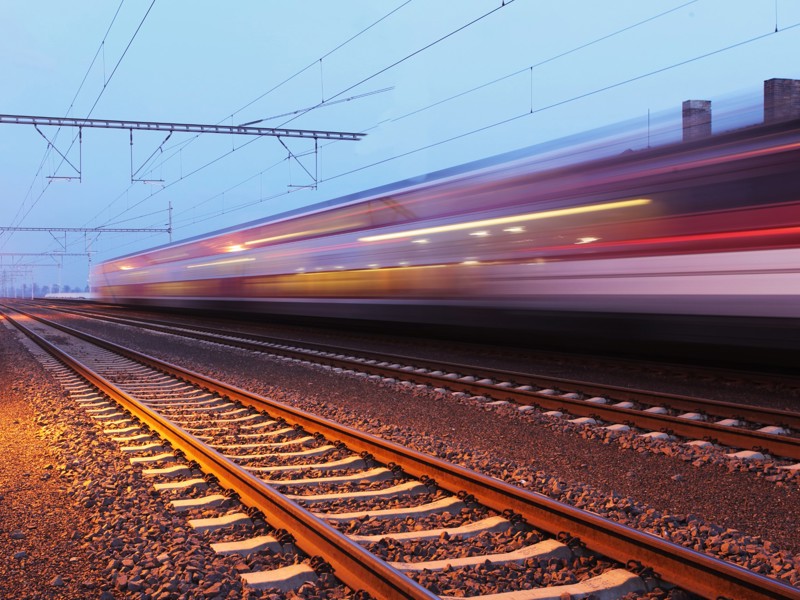 Train speeding along rail tracks