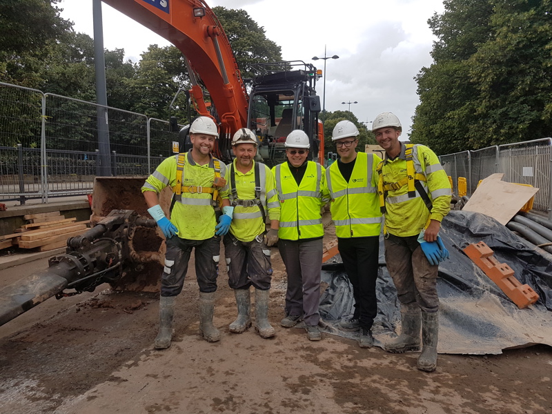 a group of men in PPE.