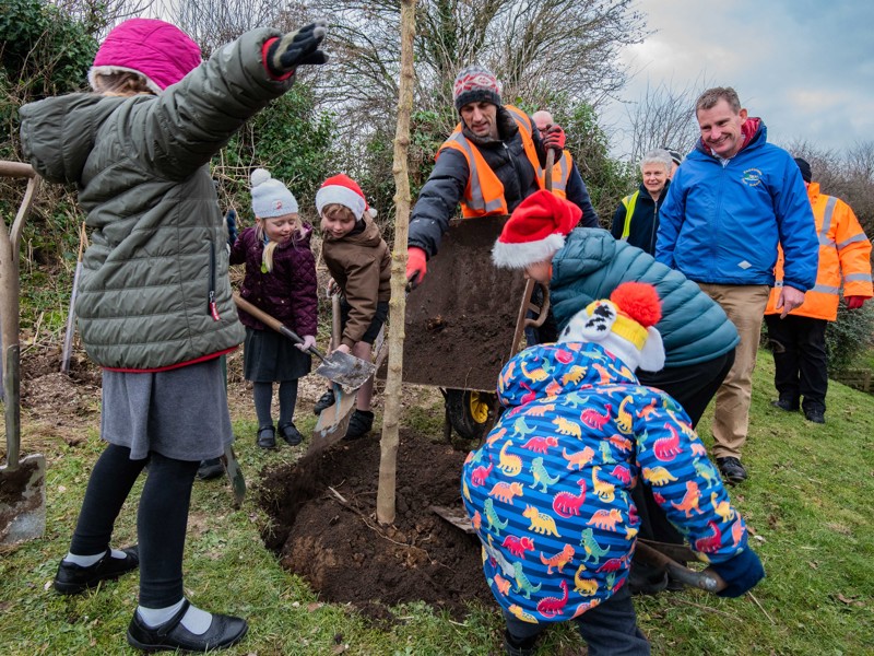 Amey and Tivoli volunteers, planting a tree to complete a community project event.