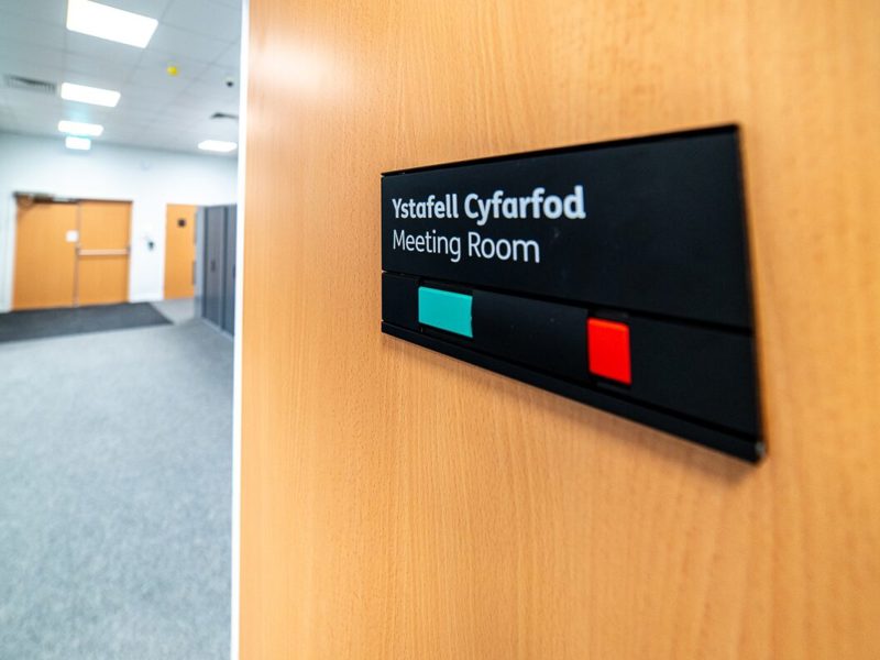 image of a meeting room door sign.