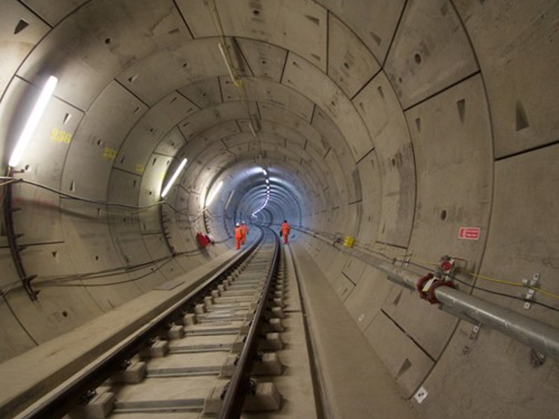 image of workers in a train tunnel 