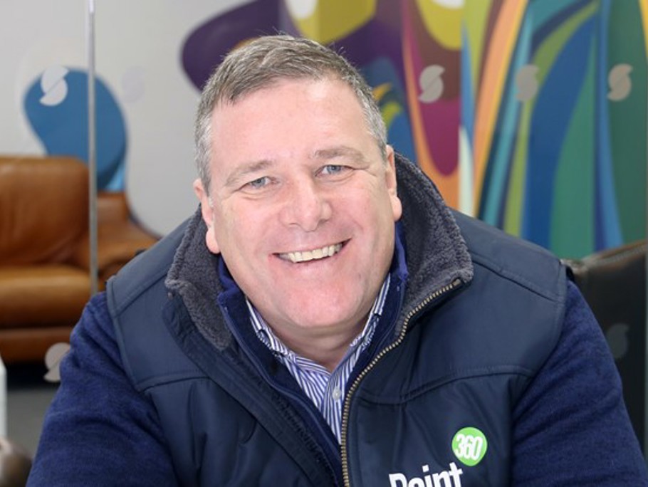 Image of a man smiling at the camera