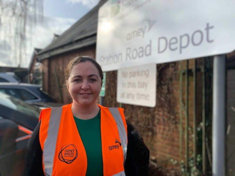 Women in PPE, stood in front of Amey Station Road depot sign.